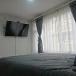 Habitación Privada Cerca al Aeropuerto y Terminal